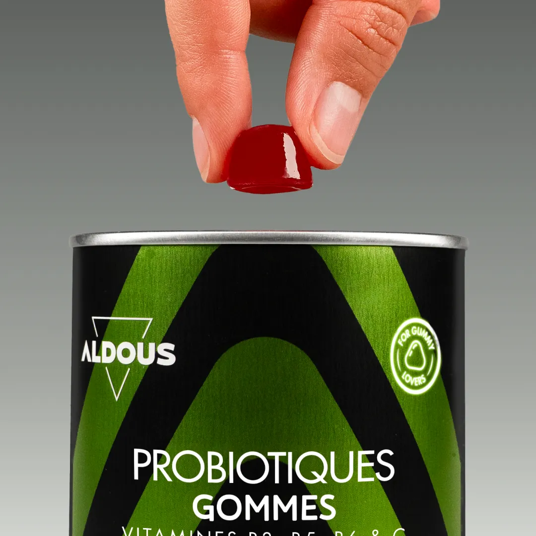 Prise de Probiotiques avec vitamines en gummies Aldous avec dose du complément